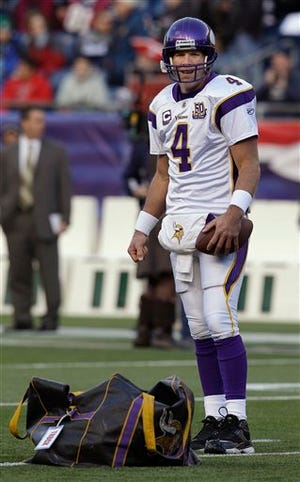 Minnesota Vikings quarterback Brett Favre stands on the field during warmups for an NFL football game against the New England Patriots in Foxborough, Mass., Sunday, Oct. 31, 2010. (AP/Photo/Stephan Savoia)