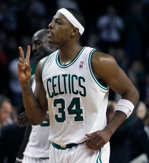 Boston Celtics' Paul Pierce celebrates after making his 20,000th career point on a free throw in overtime during an NBA basketball game against the Milwaukee Bucks, Wednesday, Nov. 3, 2010, in Boston. The Celtics won 105-102. (AP Photo/Michael Dwyer)