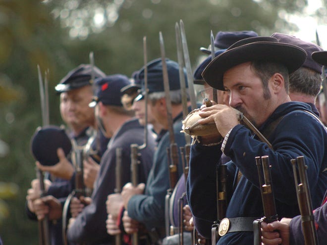 A Union soldier drinks from a canteen during practice before the 2009 Ocklawaha River Raid re-enactment at the Florida Carriage Museum.