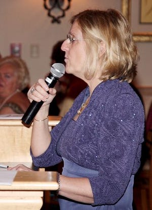 EJ Hersom/Staff photographer Martha Jo Hewitt, executive director of the Cocheco Valley Humane Society, speaks at the society's annual dinner in South Berwick, Maine Friday.