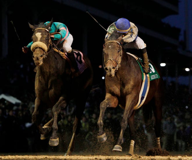Blame (right), with Garrett Gomez in the saddle, edged Mike Smith and Zenyatta by a head in the Breeders' Cup Classic.