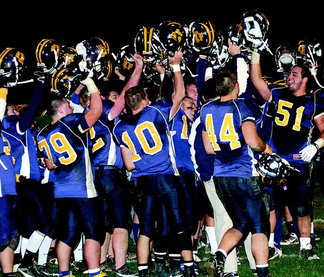 Blue Devil football players celebrate after Friday's game. See photo gallery for more pictures from the game.