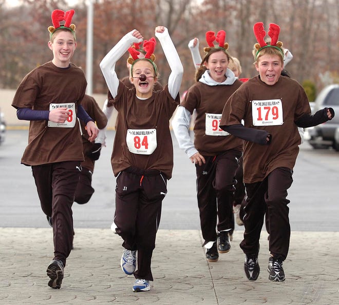 Santa’s reindeer, led by Felica Mulholland of Brockton, center, participate in the 2008 Jingle Bell Run.