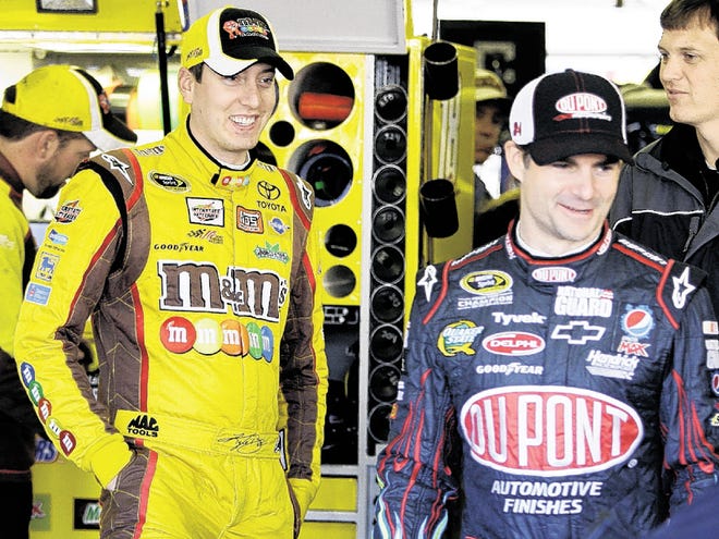 NASCAR Sprint Cup Series drivers Kyle Busch, left, and Jeff Gordon, right, talk before practicing for the AAA Texas 500 auto race at Texas Motor Speedway Saturday, Nov. 6, 2010, in Fort Worth, Texas. (AP Photo/)