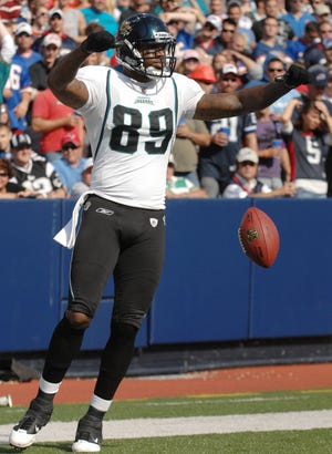 Jaguars tight end Marcedes Lewis celebrates his touchdown catch against the Bills at Ralph Wilson Stadium in Orchard Park, N.Y., on Oct. 10. Lewis has caught seven touchdown passes this season, one fewer than all of the Jaguars' wide receivers combined.