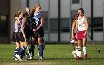 Photo by Daniel Freel/New Jersey Herald 
 
West Essex’s Alexis Miller, center, hugs teammate Natalie Cafone as Newton goalkeeper Amanda Norman, left, looks on following Cafone’s second-half goal during their North 1, Group 2 championship match Monday at the Merriam Avenue School, in Newton. The Braves lost, 4-2.