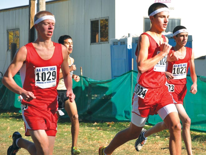 From left, Morton boys cross country runners Luke Riffle, Grant Klobuchar and Walter Jankowski participate in Saturday’s Illinois High School Association Class 2A state final at Detweiller Park. In their first team berth since 1960, the Potters placed ninth.