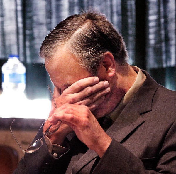 Roger Q. Melson Jr. wipes his face Tuesday during his sentencing.
 JIM BECKEL - THE OKLAHOMAN