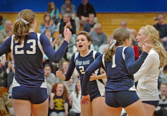 Notre Dame volleyball players, from left, Katy Litka, Kelcie Sullivan, Natalia Maccarrone and Randi Whitham, celebrate during their tournament win over Braintree.