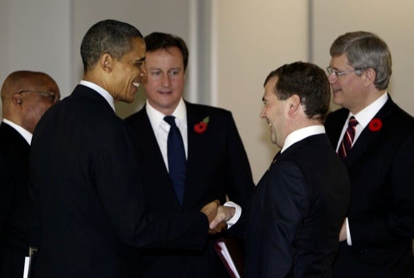 U.S. President Barack Obama, second left, smiles with other leaders, Britain's Prime Minister David Cameron, third left, Russia's President Dmitry Medvedev, second right, and Canada's Prime Minister Stephen Harper, right, at the G-20 working dinner at the National Museum of Korea in Seoul South Korea, Thursday, Nov. 11, 2010.