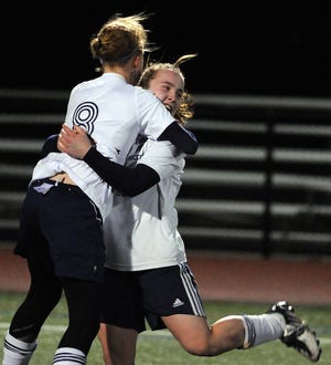 Franklin's Kristi Kirshe (right) is hugged by Jenn Coppola after scoring the clinching goal in the Panthers' shootout win over Wellesley last night.