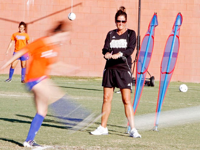 University of Florida head soccer coach, Becky Burleigh watches as a player practices a penalty kick on Wednesday, Nov. 11, 2010.
