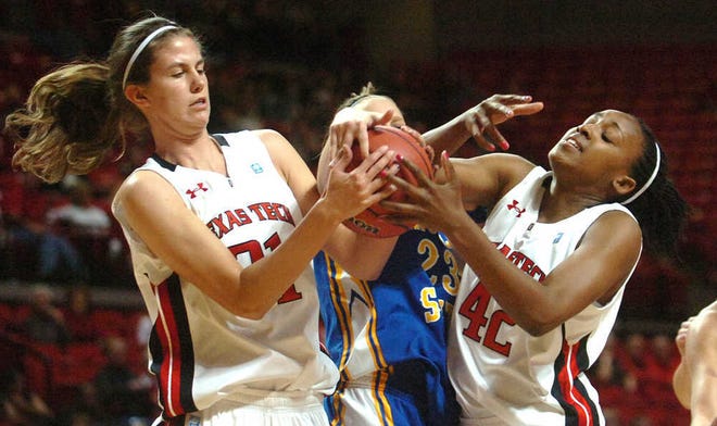 Texas Tech’s Haley Schneider, left, and Ebony Walker battle for a rebound during their exhibition game against Angelo State on Sunday. Walker will be going home Friday when the Red Raiders face New Mexico in Albuquerque.