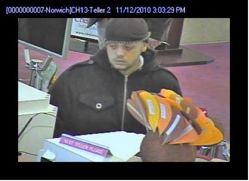 On Friday November 12, 2010 at 3:05PM, members of the City of Norwich Police Department Patrol Division responded to the Chelsea Groton Savings Bank located at 1 Franklin Sq. Norwich for a report of a robbery. Police determined a hispanic male subject confronted the bank tellers and displayed a note demanding money. The male subject fled the store with an undisclosed amount of cash. No weapon was displayed and no one was injured during the incident.  

Police were provided the following description of the suspect committing the robbery:

Hispanic male, 25-30 years of age, 5’5” tall, medium build, brown eyes.

The suspect was wearing a dark colored hooded sweatshirt, dark colored wool type cap, and dark colored faded jean type pants. 

Police have obtained photos of the suspect and are seeking the public help in identifying him.

The investigation is ongoing and Police are asking anyone with information regarding this incident to call the Norwich Police Department at 886-5561, or the Anonymous Tip Line at 886-5561, extension 500. 
		 	
Photo contributed by the Norwich Police Department
Stephany Bakoulis
Detective Lieutenant
Norwich Police Department