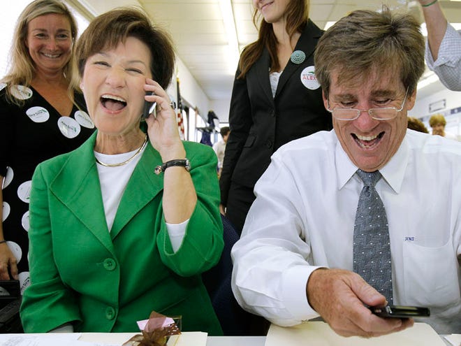 Former Florida Democratic gubernatorial candidate Alex Sink, left, and running mate Rod Smith laugh as they talk to potential voters on the phone during a visit to the Sarasota County Democratic Party headquarters on Nov. 1 in Sarasota. Smith is preparing a run to try to lead his bruised but beloved party. (The Associated Press/File)