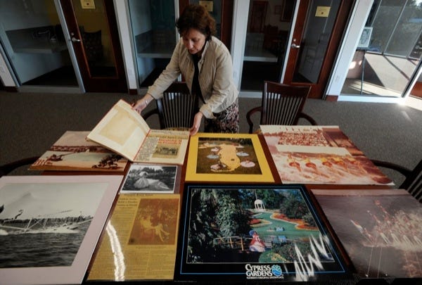 ARCHIVIST<0x00A0>LuAnn Mims looks over some materials from the Cypress Gardens Collection in the Sarah D. and L. Kirk McKay Archives Center at Florida Southern College in Lakeland.