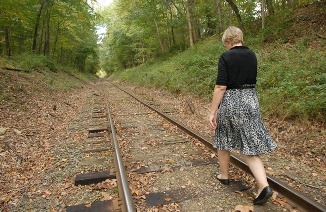 Cathy Osten, Sprague first selectman walks along railroad tracks running through Sprague September 23, 2010.