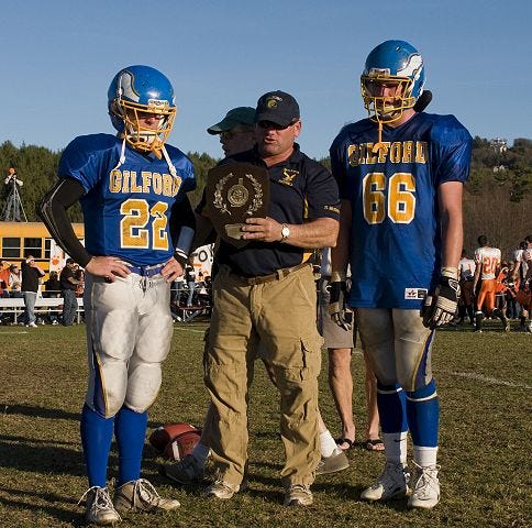 R.C. Greenwood photo

Gilford coach Mark Brewer, center, accepts the second place trophy with James Seager, left, and Brendan Demo after losing the Division VI final against Newport Saturday afternoon in Gilford.
