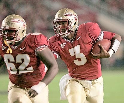 Florida State's EJ Manuel (3) follows the block of Rodney Hudson for a gain against Clemson in the first quarter of an NCAA college football game on Saturday, Nov. 13, 2010 in Tallahassee, Fla.(AP Photo/Steve Cannon)