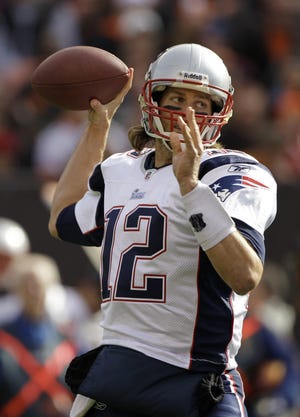 New England Patriots quarterback Tom Brady passes during the first quarter of an NFL football game against the Cleveland Browns, Sunday, Nov. 7, 2010, in Cleveland. (AP Photo/Amy Sancetta)