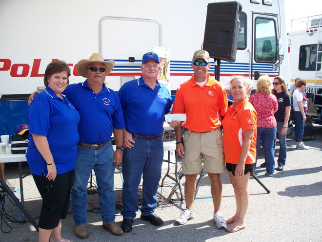 From left are JFA and Dream Day members Cindy and Rodney Savoy, JFA President Wally Taillon, Lt. Carl Dabadie of the Baton Rouge City Police, and Irene Mansur, Dream Day Foundation.