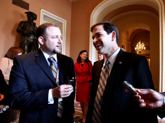 Sen.-elect Marco Rubio talks to reporters on Capitol Hill in Washington on Monday. (The Associated Press)