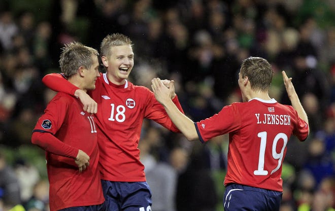 Norway's Erik Huseklepp, center, reacts with Morten Gamst Pedersen, left, and Ruben Yttergard Jenssen after Huseklepp scored Norway's second goal against the Republic of Ireland's on Wednesday in Dublin.
