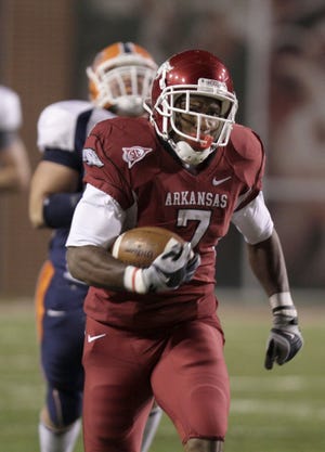 Arkansas running back Knile Davis carries during the first quarter against UTEP on Saturday in Fayetteville, Ark.