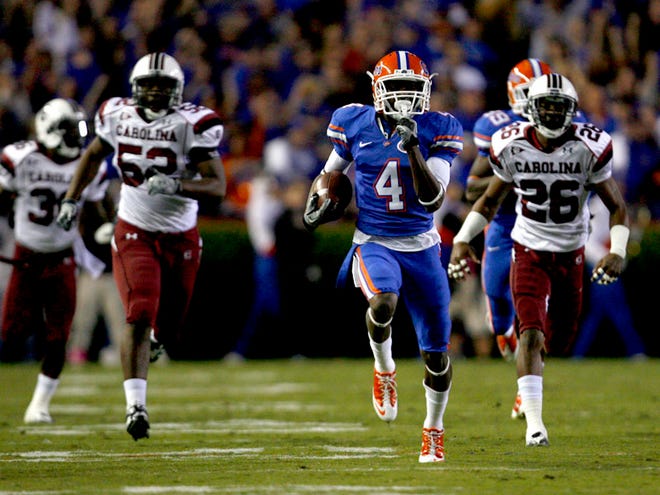 Florida Gators wide receiver Andre Debose (4) returns the opening kick off for a touchdown against the South Carolina Gamecocks at Ben Hill Griffin Stadium on Saturday, Nov. 12, 2010.
