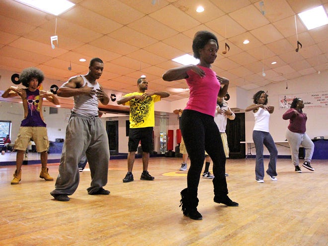 Members of “Dance Central!” rehearse with choreographer Jermaine West, far right, during a rehearsal at By Ear Musician Dance Studio.