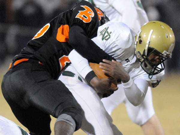 Wallace-Rose Hill's D.J. Bennerman tackles North Duplin's Toderick Gadberry on Friday night at Wallace.