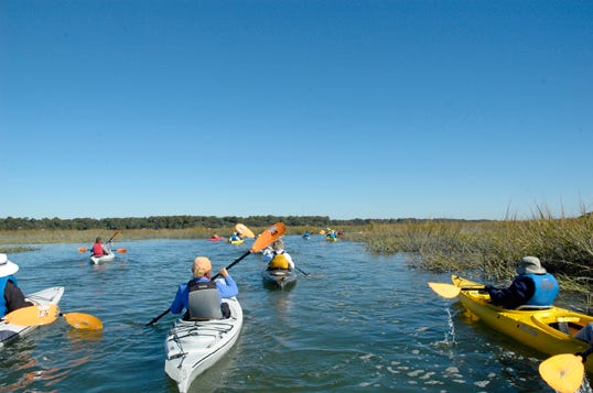 Kayakers forge through the salt marsh Nov. 12 on a kayak tour of the May River with "Tideland Treasure" author Todd Ballantine.-Sara Wright/Bluffton Today