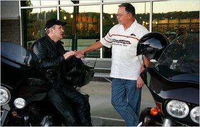 Matthew Levatich, president of Harley-Davidson, left, and Bill Peek, owner of Heart of Dixie Harley-Davidson in Pelham, Ala.