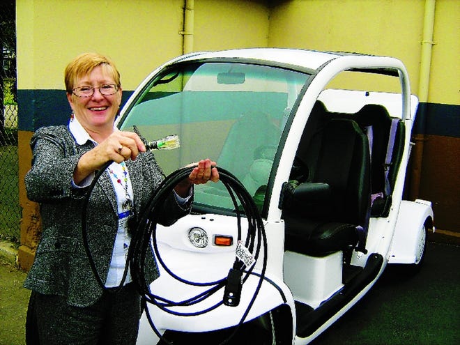Teacher Jeanne Ross is sold on her electric GEM, despite the fact that it tops out at 25 mph.