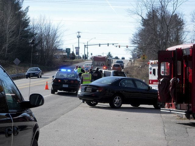 O'Donnell/Democrat photo 
Emergency responders work the scene of a two-car motor vehicle crash Sunday near Taylor Rental in Rollinsford. The drivers of each car sustained non life-threatening injuries.