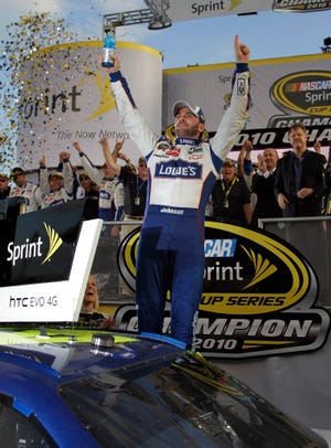JImmie Johnson celebrates Sunday after winning his fifth consecutive Sprint Cup Series Championship. The Associated Press