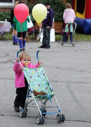 Emily Jones, 19 months, of Scituate pushes her stroller.