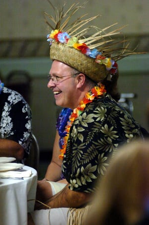 Brendan Gearty has a laugh with friends during the Norwood Circle of Hope Foundation's Beach Party at the Norwood Elks Lodge Saturday evening.