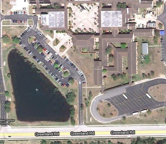 A satellite view of Mandarin High School shows the campus' lake on Greenland Road. A car was pulled from the lake Tuesday, with a body inside.
