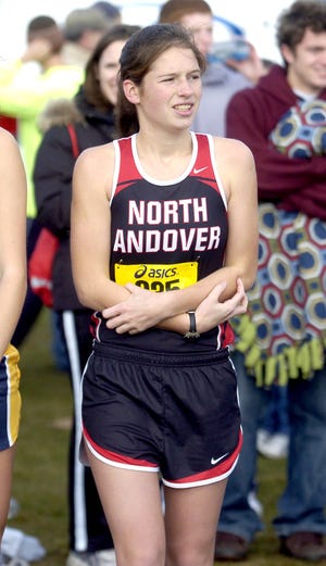 North Andover girls cross-country runner Olivia Marshall tries to keep warm, before the start of the All-State Meet at the Gardner Municipal Golf Course Nov. 20. Marshall was there, representing the Knights as an elite harrier going up against her peers throughout the state in all divisions.
