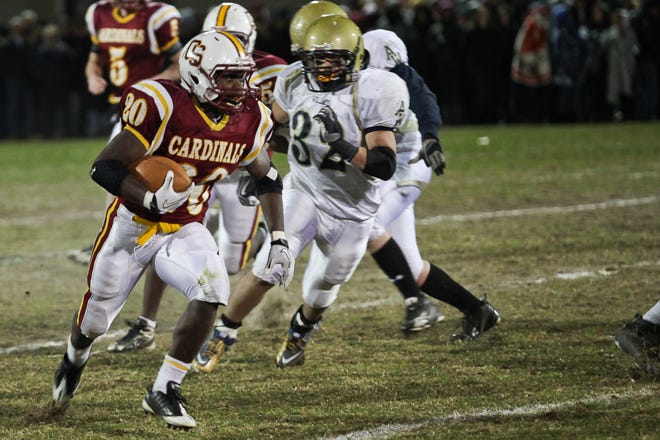Cardinal Spellman's Blaise Branch runs for some of his 196 yards during the Cardinals' 42-0 victory on Wednesday night.