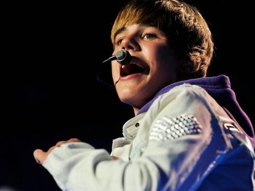SINGER JUSTIN BIEBER performs at Madison Square Garden on Aug. 31 in New York. His holiday merchandise, including a doll has hit the hot holiday toy list.