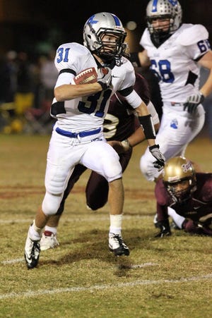 Bartram Trail's Nick Uruburu rushes during a Class 3A regional quarterfinal playoff game on Nov. 19 against St. Augustine. The Oldest City's Yellow Jackets won, 16-15.