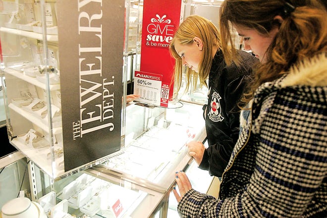 Photo by Amy Paterson/New Jersey Herald
 
Rachel McAuliffe, of Frankford, right, watches as Ayla Utter, also of Frankford, checks out the necklaces for sale at Kohl's in Newton early Friday morning. Utter, who woke up at 3:30 a.m. to go shopping, was in search of a Christmas gift for her mother.