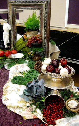 Liz Barbour sets up a display for her “Creating an Edible Still Life Buffet” event at the Burlington Public Library on Nov. 18