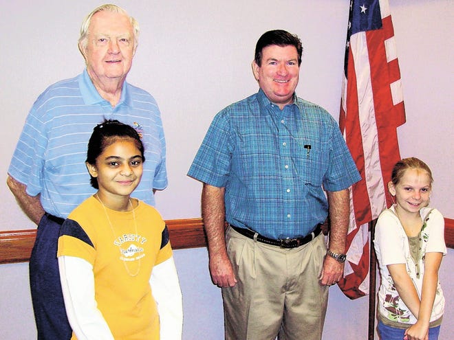Pat Patel of the Jewett School of the Arts, front left, and Julia Burkett of Jewett Academy, right, are all smiles after winning their respective divisions in the 2010 Youth Spelling Bee sponsored by the Knights of Columbus Council 7091 of Cypress Gardens. Also pictured are event chairman Bob Connell, back left, and council Grand Knight, Ed Sheehan.