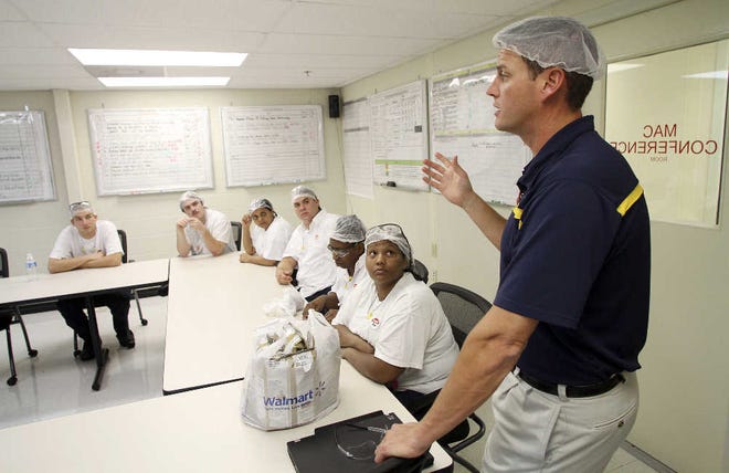 Dennie McLaughlin speaks during a shift meeting at the Campbell Soup Co. plant in Maxton N.C. The company is asking workers to help save the company money by working smarter with existing technology.