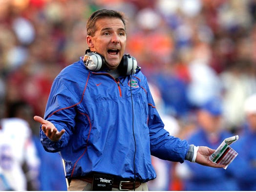 Florida coach Urban Meyer throws up his hands during the first half of the Gators' game against Florida State University at Doak Campbell Stadium in Tallahassee, Florida November 27, 2010.