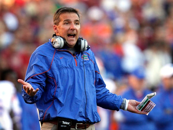 Florida coach Urban Meyer throws up his hands during the first half of the Gators' game against Florida State University at Doak Campbell Stadium in Tallahassee, Florida November 27, 2010.