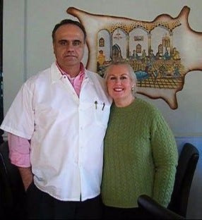 Mehrdad and Kathleen Niknezhad, owners of Chaloos Restaurant, a new Persian eatery, pose inside their restaurant.